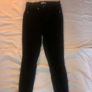 Suede textured, high waisted black skinny jeans.